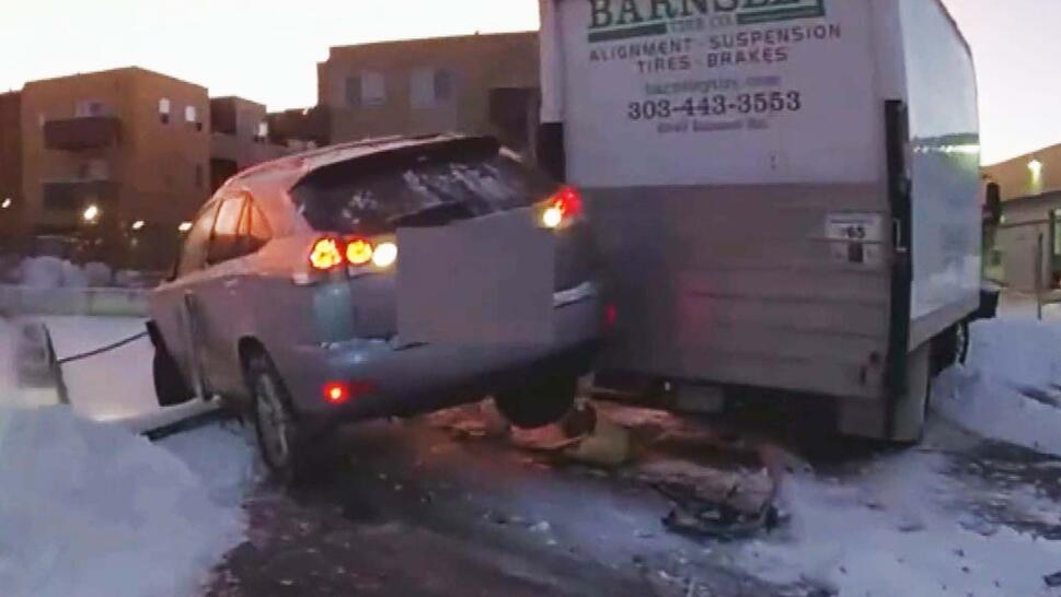 SUV hanging off a box truck