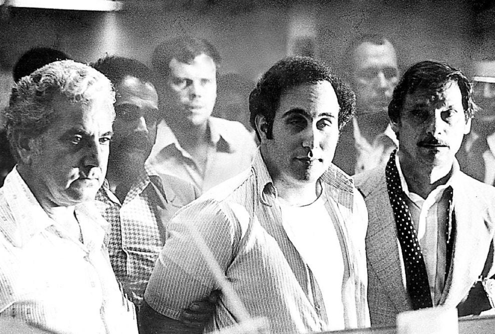 "Son of Sam," David Berkowitz, stands before Criminal Court Judge Richard Brown at the Criminal Court building in Brooklyn, N.Y. to hear charges accusing him in six random murders on August 11, 1977.