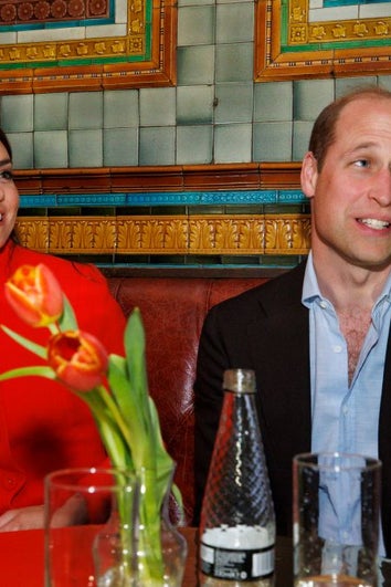 Prince William, Prince of Wales and Catherine, Princess of Wales chat to local business people as they visit the Dog and Duck pub in Soho ahead of this weekend's coronation on May 4, 2023 in London, England.