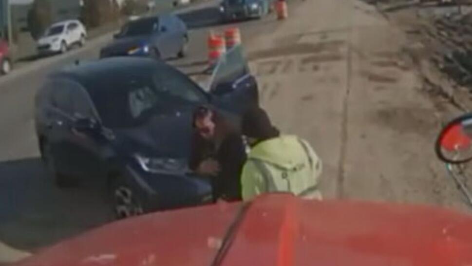 Truck driver helping woman