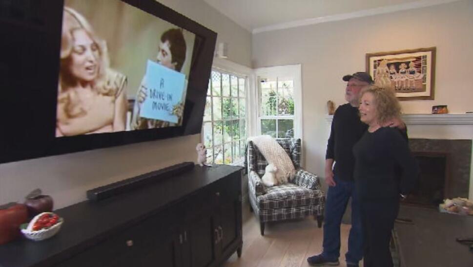 Sharon and Garvin Kotzin watching themselves on tv